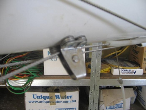 then through stainless pulley rivered to underside of boom tube