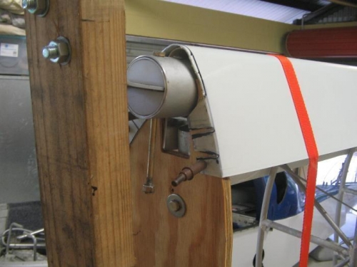 lower inboard edge bent over and clecoed