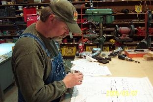 Working on the hinge bracket bearing.