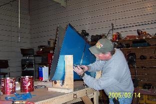 Cleaning plastic away from holes for dimpling