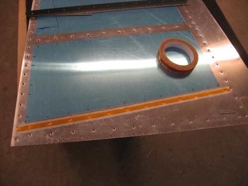 Rivet tape to hold rivets when flipping the skin around to backrivet