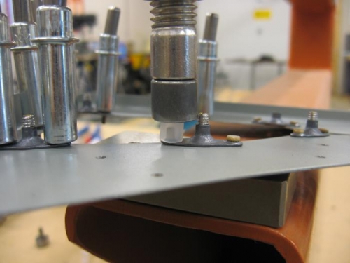 Used a piece of nylon tubing to press the nutplate down while rivetting