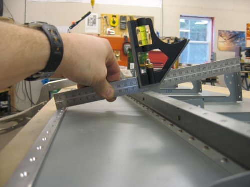 Verifying rear spar angle after riveting top skin in place