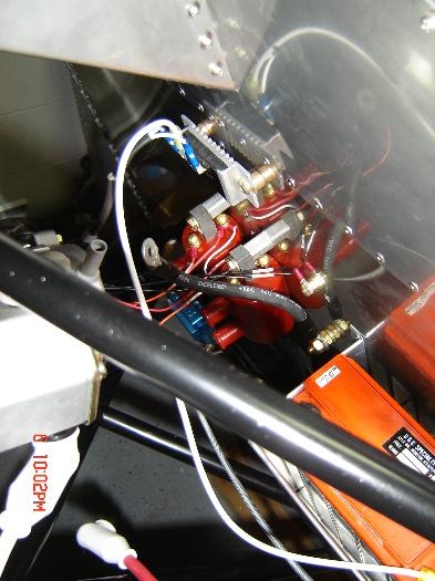 Voltage regulator above the coils.