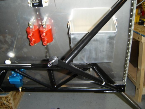 Mounted in place.  The hold down strap will be riveted on after the battery is installed.