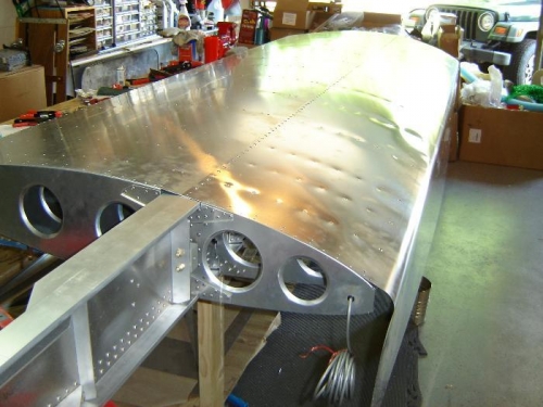 Top side of LE skin riveted in place.