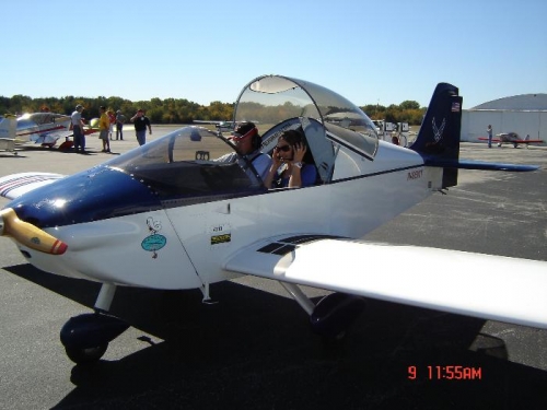 No the picture is not reversed.  Walt flies from the right seat.