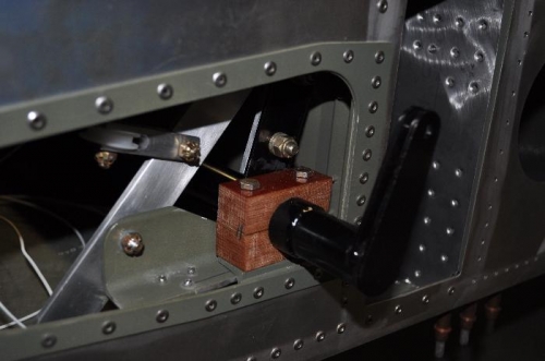 Left side flap drive block and bottom of brake handle.