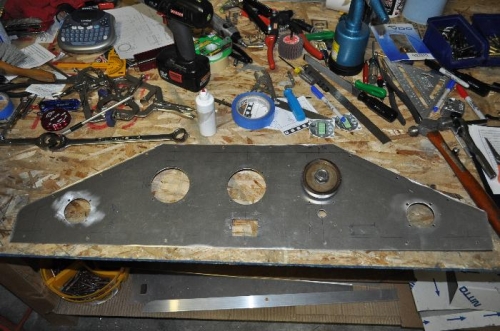 Instrument holes cut.  Cutter attached to the comm pilot hole.