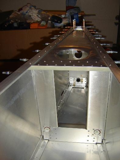 Shear web riveted into place.