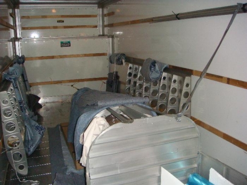 Inside the U-Haul.  The fuselage and wings were SECURELY anchored.  (Other parts in fuselage)