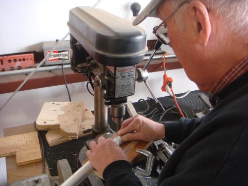 Cormac drilling the holes for the rivets while I held the pushrod