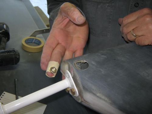 Msking tape inside-out holding the nut.