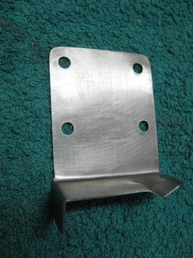 iniahed striker plate for overhead latch