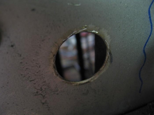 22mm hole through firewall - ready for deburring.