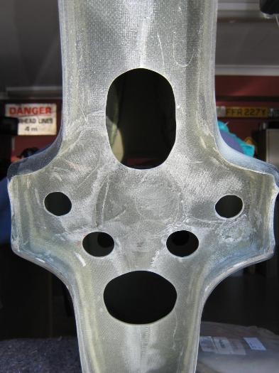 Cut access holes in rear of fin