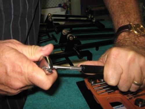 Tapping powder coating from nut in connecting rod