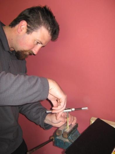 Rodney tapping out turnbuckle threads