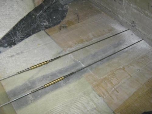 Turnbuckles behind seat area