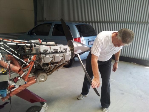 Hand spinning the engine to prime the system.