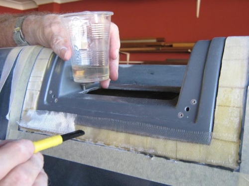 Glassing the mount into the cutout in the wing leading edge