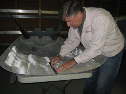 Cutting glass to reinforce the top cowl.