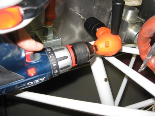 Using the right angle drill.