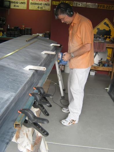Using belt sander to trim trailed edge