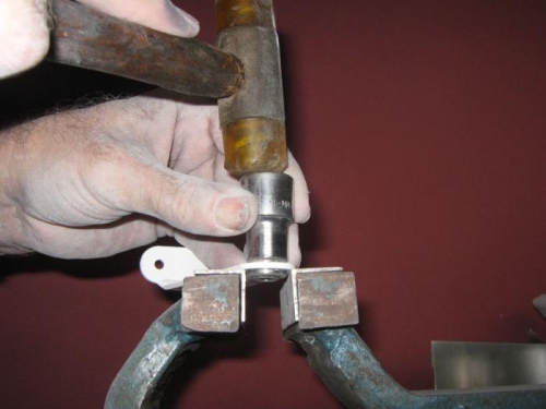 Using a 12mm socket to drift the bearings in