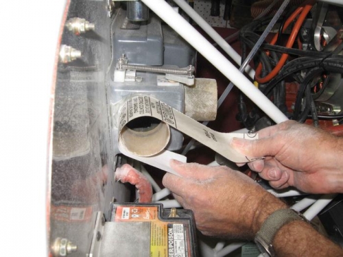 Sanding down fibreglass flange.