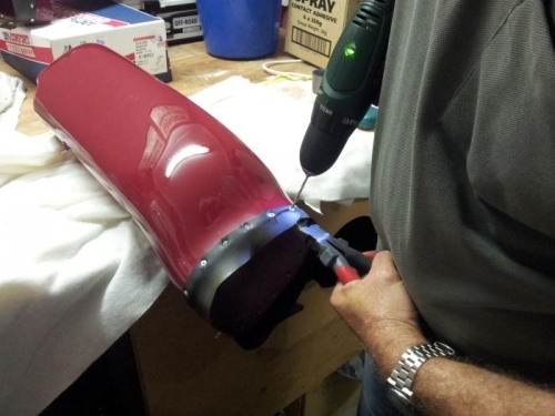 Drilling out each of the rivets.
