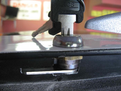 Latch assembly installed in the rear of the canopy.