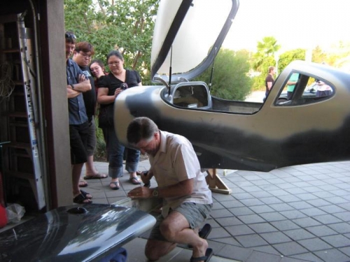 Smoothing the top of the difficult spar.