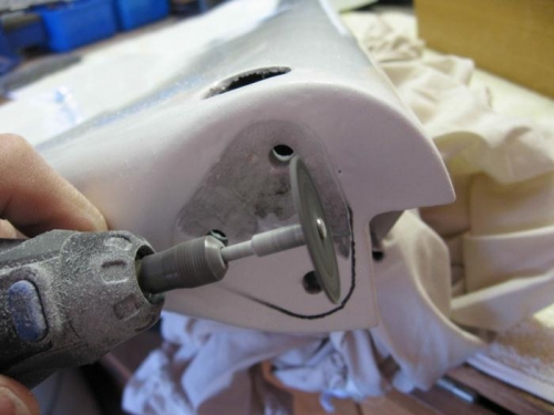 Cutting paint from the elevator ends.