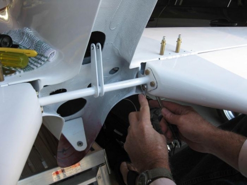 Bolting the elevator bell crank in place.