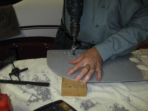 Drilling holes for circuit breakers.