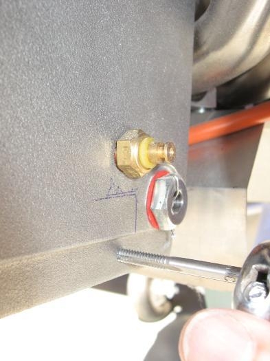 Drilling and tapping the fins to affix the cooling duct