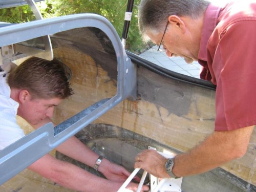 Reassembling the spar box in the fuselage.
