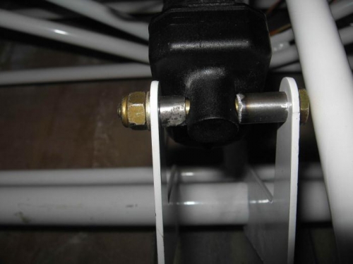 Spacing tube on flap actuator bolt.