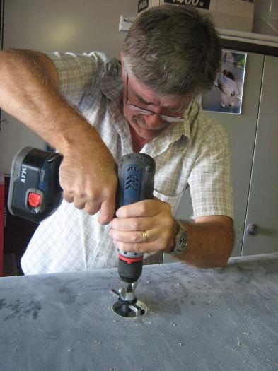 Cutting the holes for the fuel filler collars and caps.