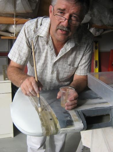 Applying the second strip of glass over the wing tip joints.