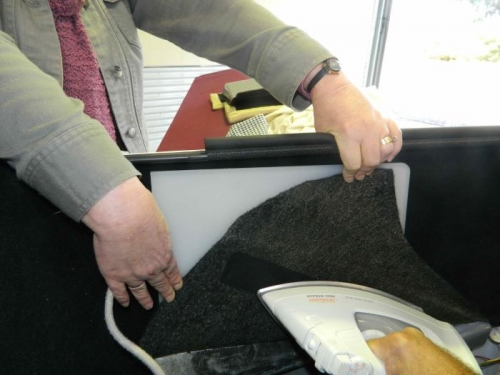 Ironing reinforcing cloth to the back of the liner.