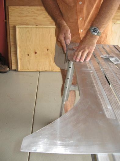 Trimming the side panels for the console.