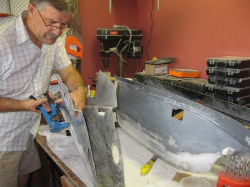 Fitting nutplates to the base console.