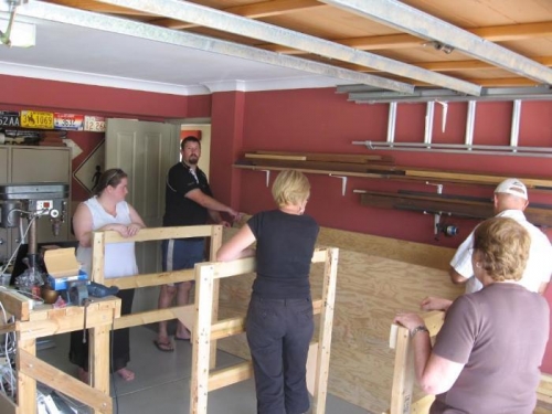 All hands holding pieces for assembly