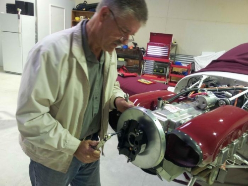 Tensioning the flange bolts holding the spinner back plate and the back of the hub assembly.