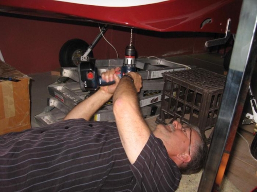 Drilling the holes for the transponder antenna and outside air temp sensor.