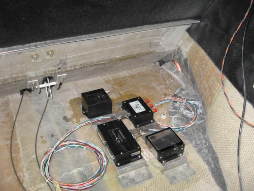 Units bolted to the mounts - and mounts glassed to the parcel shelf area floor.