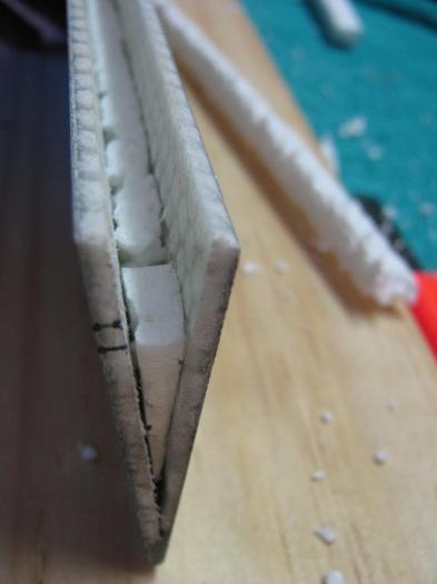 Filling with foam prior to laying fibreglass sheet in the recess to strengthen