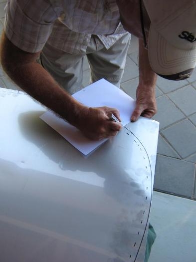 Mark marking the cut line inside the traced line from the fuse.
